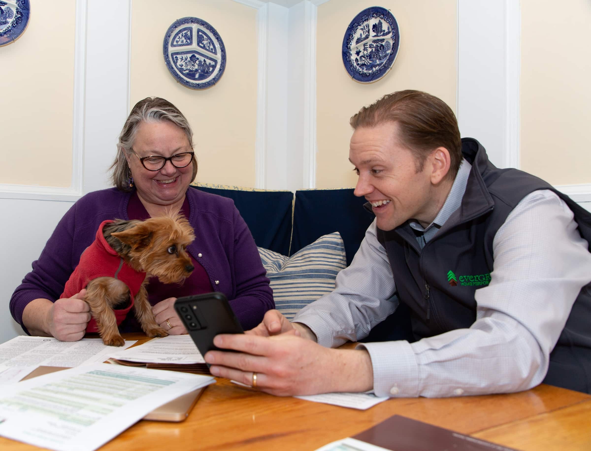 Evergreen Team Reviewing Tax Credits and Incentives With Homeowner