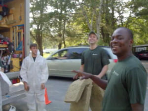 Evergreen Home Performance employees chatting and laughing together outside truck