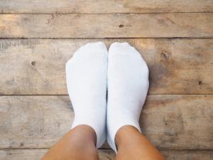 feet with socks on cold floor