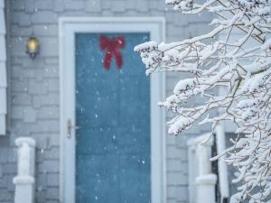 snowy front door of maine house
