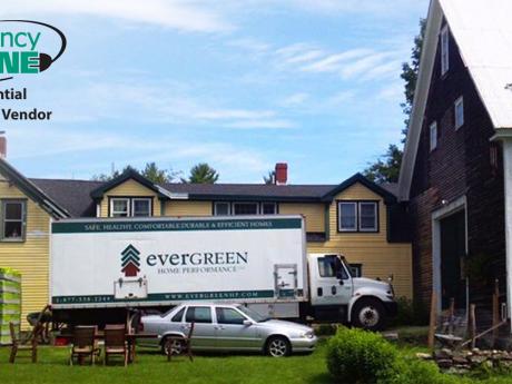Evergreen truck with Efficiency Maine logo