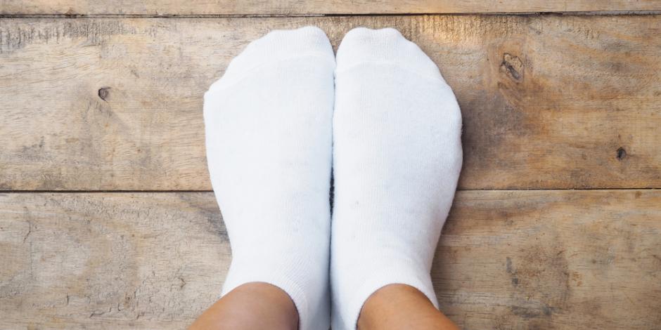 feet with socks on cold floor