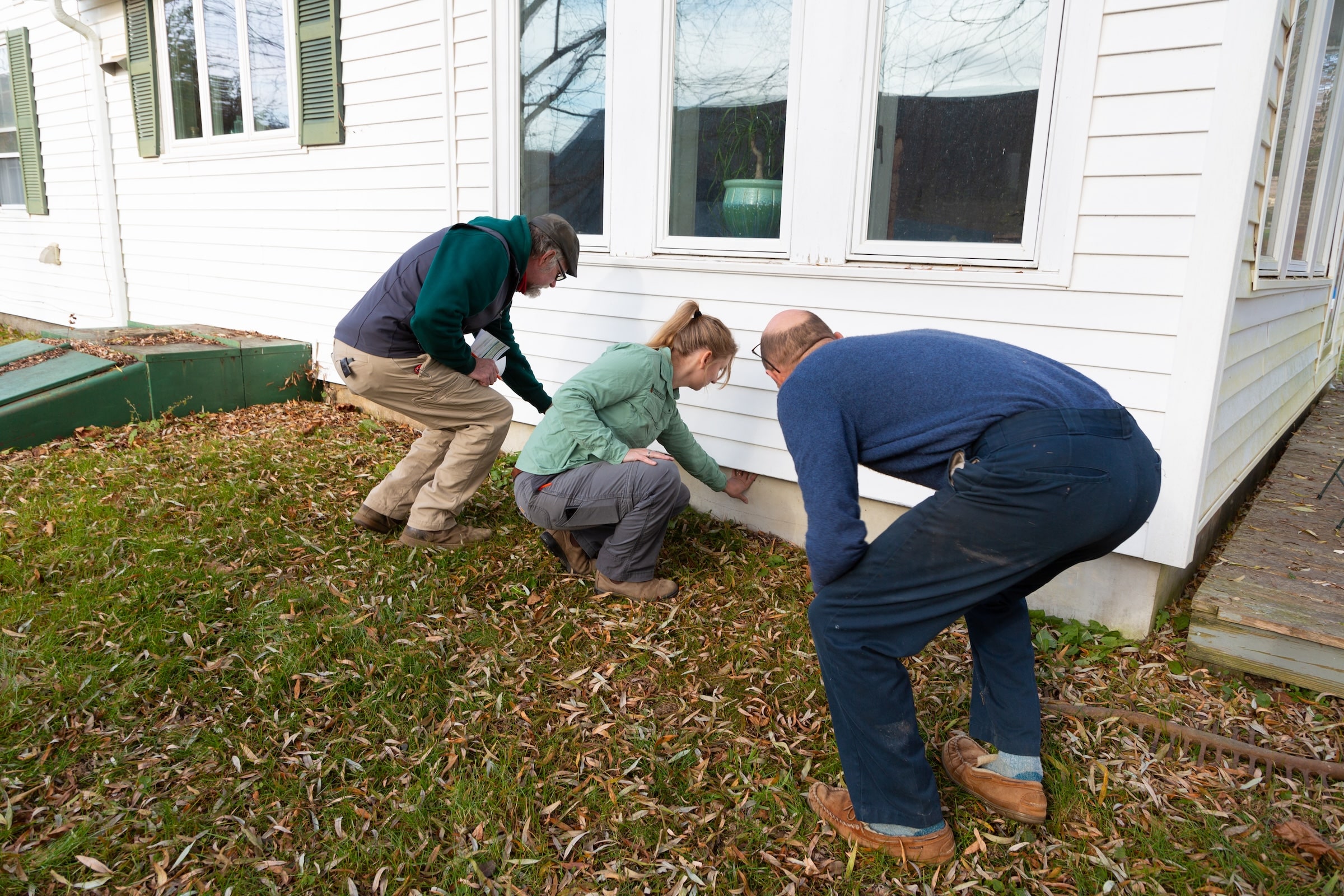 Evergreen team inspecting an old house