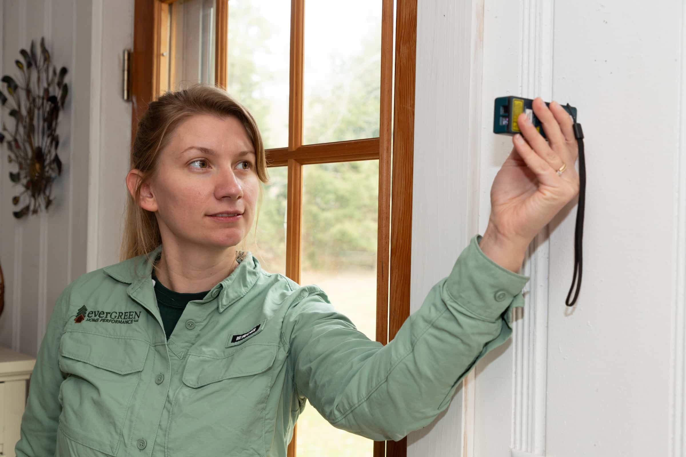 Evergreen team member inspecting house
