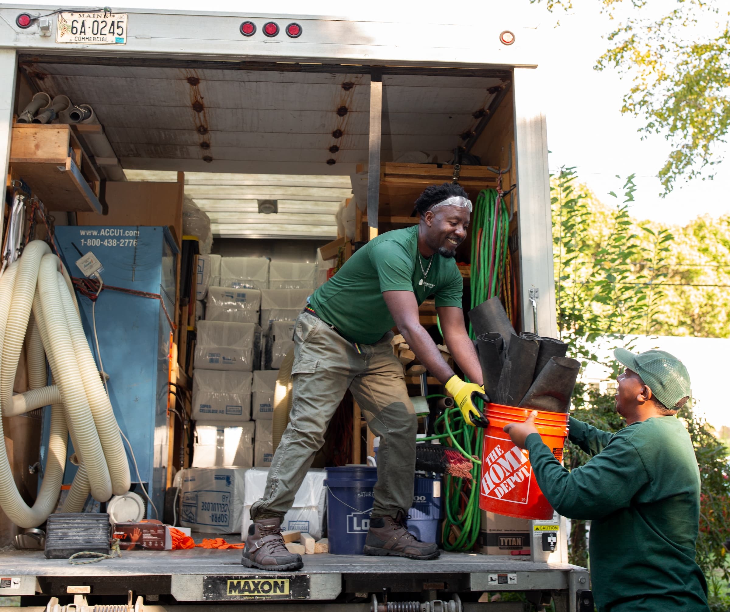 Evergreen Attic Insulation Team Getting Equipment Out Of The Truck