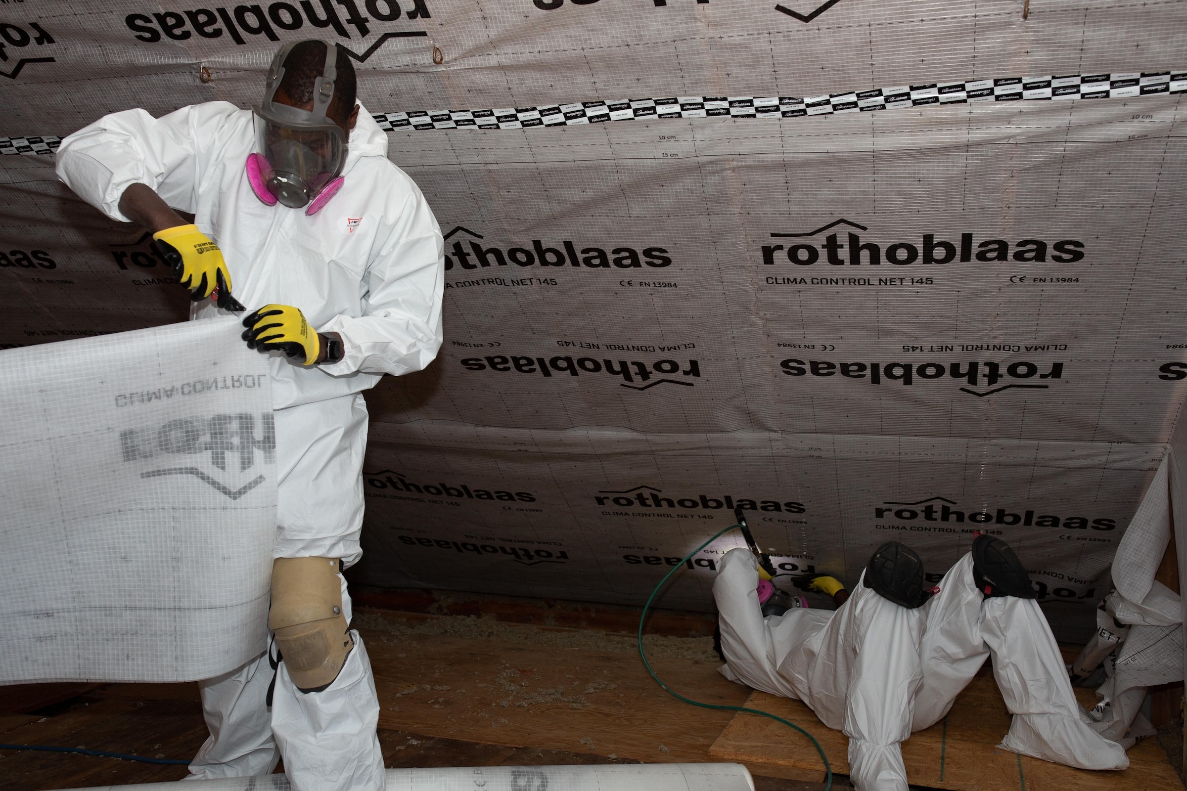 Evergreen Home Performance Team Installing Attic Insulation