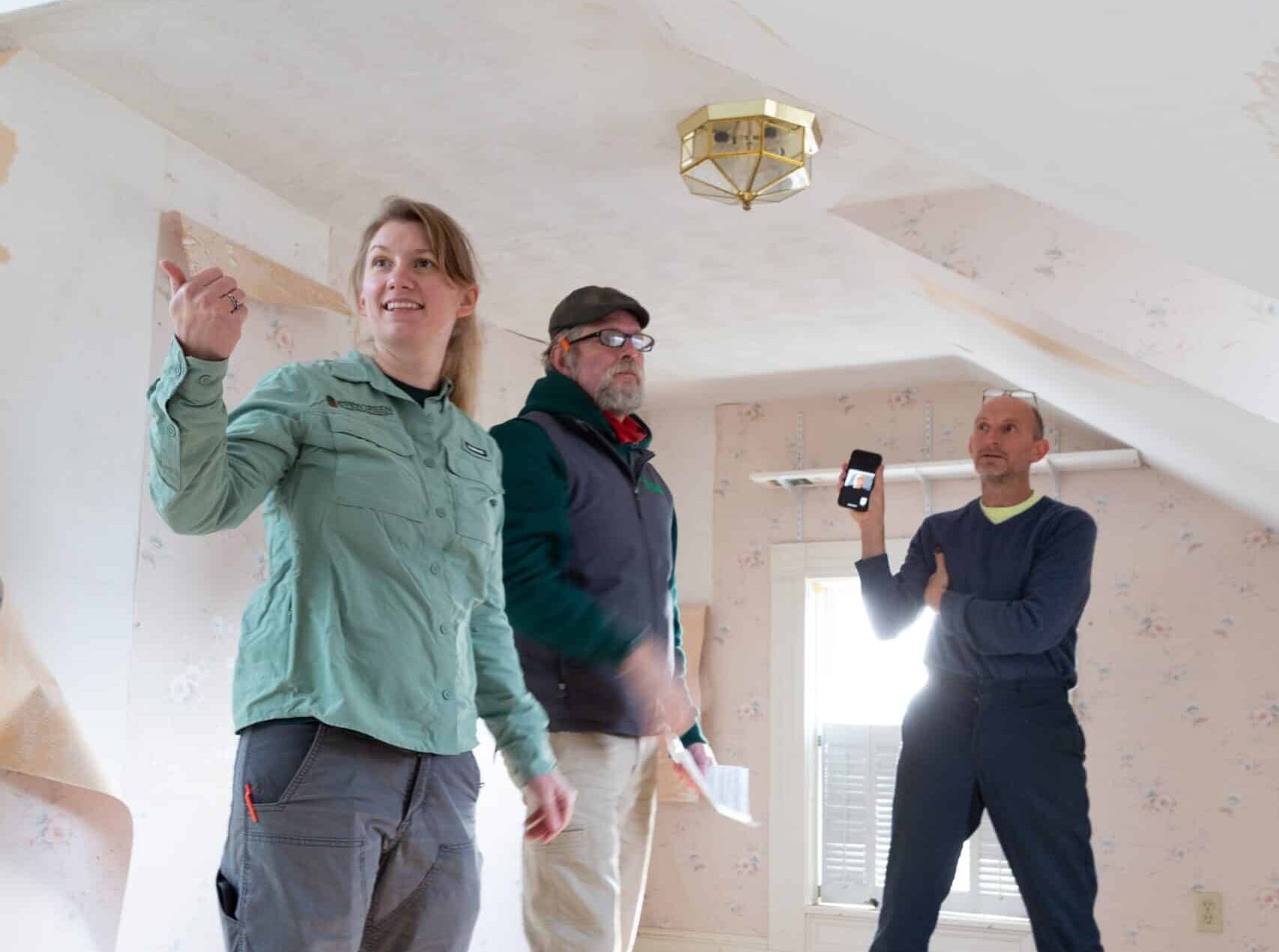 Evergreen team walking-through a house together