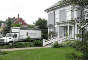 Evergreen Home Performance Box Truck In Driveway Of Home
